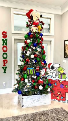 a decorated christmas tree in the corner of a room