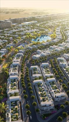 an aerial view of a city with lots of buildings and trees in the foreground