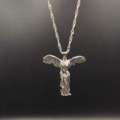 Add a touch of classical beauty to your jewelry collection with our Winged Victory of Samothrace Necklace. Inspired by the iconic Greek statue, this necklace features a detailed pendant of the Winged Victory, also known as the Nike of Samothrace. Crafted with high-quality materials, this necklace is sure to become a treasured piece in your wardrobe. Perfect for history buffs and art enthusiasts, the Winged Victory of Samothrace Necklace is a unique and meaningful addition to any outfit. The pend The Winged Victory, Nike Of Samothrace, The Goddess Of Victory, Winged Victory Of Samothrace, Classical Beauty, Winged Victory, Greek Beauty, Goddess Of Victory, Stylish Art