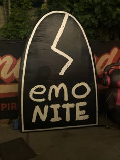 a sign that says emo nite with a lightning bolt in the bottom corner