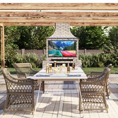 an outdoor dining table with four chairs and a flat screen tv mounted on the wall