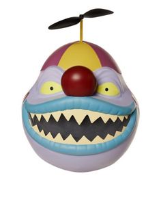 an odd looking ball with a clown face on it's head and tongued teeth