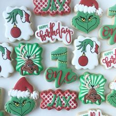 decorated cookies are arranged on a white surface