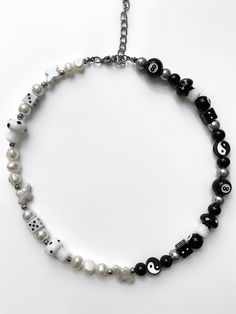 The 'YIN & YANG' half black, half white freshwater pearl necklace is what you've been waiting for - perfect for those who are looking to dress up any outfit! No matter how this piece is styled, the 'YIN & YANG' will get heads turning, guaranteed.  Made with lamp work glass charms and genuine freshwater pearls. Yin Yang Necklace, Glass Charms, Freshwater Pearl Necklace, Creating Jewelry, White Freshwater Pearl, Freshwater Pearl Necklaces, Yin Yang, No Matter How, Fresh Water