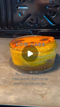 a bowl of food sitting on top of a counter in front of an oven with the words low carb written above it