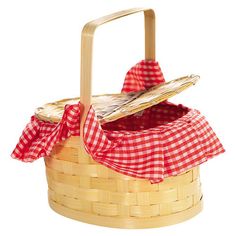 an empty picnic basket with a red and white checkered cloth on the top, sitting in front of a white background