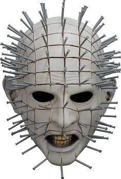 a white mask with spikes on it's face