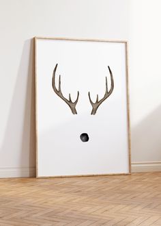 a deer's head with antlers is shown on the wall