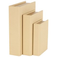 three beige books are stacked on top of each other