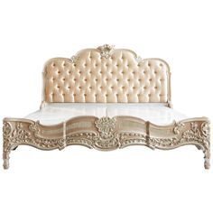 an antique style bed with gold trimmings