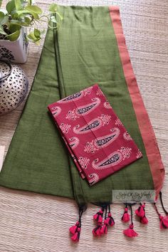 Handloom soft mul cotton saree in mehndi green color with contrast sleek border and the pallu is adorned with tassels, comes with running blouse piece, along with an extra cotton printed mix-and-match blouse piece. Details: Material: Cotton Blouse: Yes, with a running blouse piece along with an extra printed cotton mix-and-match blouse piece Saree Length: 6.35 meters Saree width: 46 inches Fall & Picot: You do not need any extra effort and time to get the saree ready with the fall and picot, we'll do the fall and edging of the saree so that you can receive a hassle-free ready-to-drape saree. Wash & Care: normal wash at home with gentle detergent Avoid contact with direct sunlight for drying and harsh liquids and perfumes. Disclaimer: * We try to stay as accurate to the original color of th Green Cotton Silk Dupatta With Kalamkari Print, Cotton Dupatta With Border For Diwali, Festive Green Cotton Dupatta, Traditional Green Cotton Dupatta, Green Cotton Dupatta For Festivals, Green Dupatta With Kalamkari Print, Diwali Green Dupatta With Kalamkari Print, Diwali Green Kalamkari Dupatta, Green Saree With Kalamkari Print For Diwali