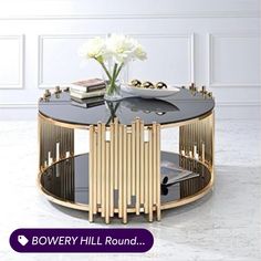 a black and gold coffee table with flowers in it on a white marble flooring