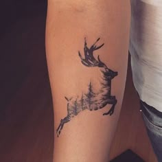 a deer tattoo on the right arm