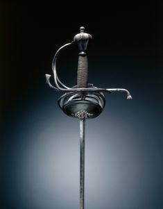 Rapier, c.1625-1650 Federico Picinino (Italian) steel; hilt russeted; wire grip, Overall - l:144.80 cm (l:57 inches) Wt: 1.38 kg Quillions - w:22.50 cm (w:8 13/16 inches). Rapier Reference, European Swords, Types Of Swords, Cleveland Museum Of Art, 17th Century, Ceramic Mugs, Museum Of Art, Canvas Print Wall