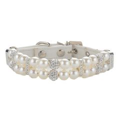 a white bracelet with pearls and diamonds