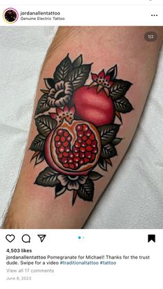 a tattoo with pomegranates and leaves on it