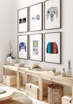 a living room with four framed video game controllers