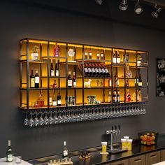 a bar with lots of bottles and glasses on it