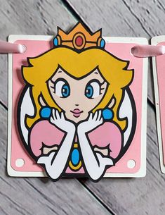 a paper cut out of an anime character with blue eyes and blonde hair, wearing a tiara