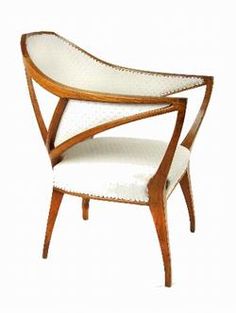 a wooden chair with white upholstered fabric