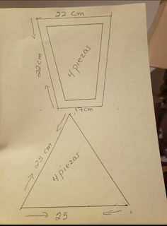 a piece of paper with a drawing of a square and triangle on it's side