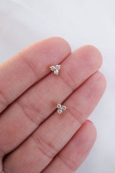 These cute trio diamond studs are the perfect addition to your ear stack! Please allow 1-2 weeks for delivery. Gold Diamond Earrings Studs, Ear Stack, Three Stone Diamond, Dainty Studs, Stone Studs, Custom Jewelry Design, Ring Collections, Three Stone, Diamond Earrings Studs