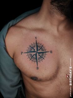 a man with a compass tattoo on his chest