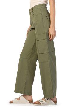 Multiple pockets up the utilitarian vibe of these casual pants cut from stretch cotton in a wide-leg silhouette for easy, all-day movement. 30" inseam; 19" leg opening; 10 1/2" front rise; 15" back rise (size 8) Zip fly with button closure Front slant pockets; back flap pockets; side cargo pockets 98% cotton, 2% spandex Hand wash, line dry Imported Wide Leg Cargo Pants, Wrap Jacket, Green Pants, Sweaters And Leggings, Jogger Jeans, Suit Shop, Jogger Sweatpants, Kids Boots