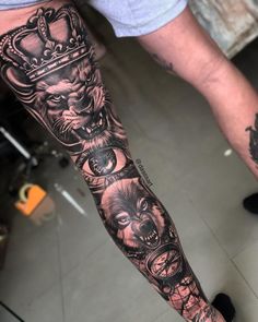 a man's arm with tattoos on it and an image of a lion wearing a crown