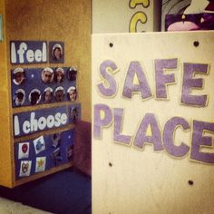 there is a sign that says safe place in front of a door with pictures on it