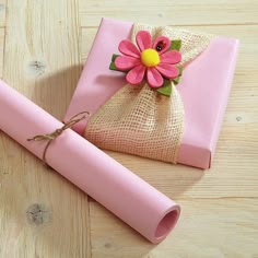 a pink wrapping paper with a flower on it