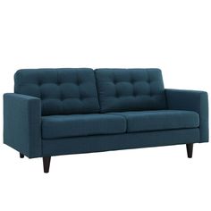 a blue couch sitting on top of a white floor