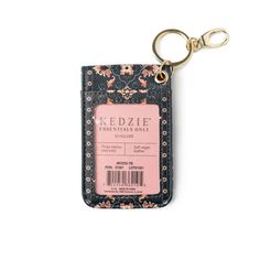 a keychain with a ticket holder attached to it