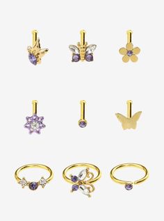 six pairs of rings with different shapes and sizes, all in yellow gold plated metal