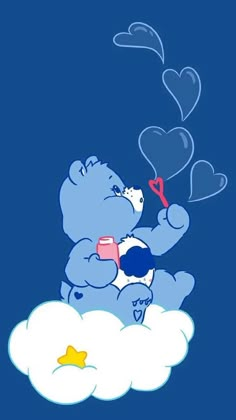 a blue teddy bear sitting on top of a cloud holding a heart shaped balloon in the sky