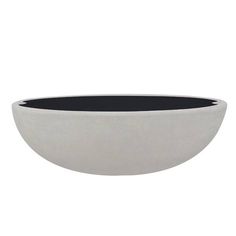 a black and white bowl sitting on top of a table