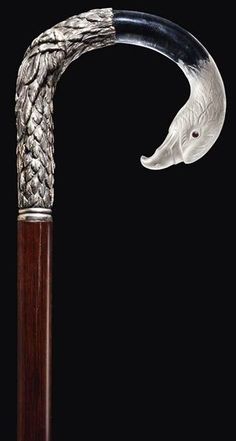 a cane with an animal's head on it