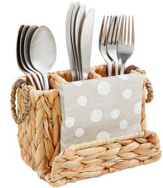 a basket filled with silverware sitting on top of a table