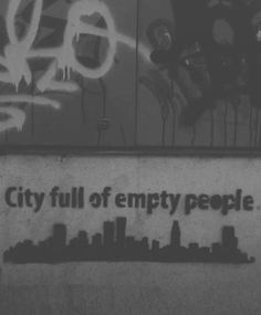 the city full of empty people has graffiti on it