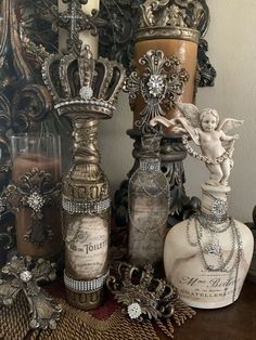 an assortment of decorative vases sitting on top of a table next to a mirror