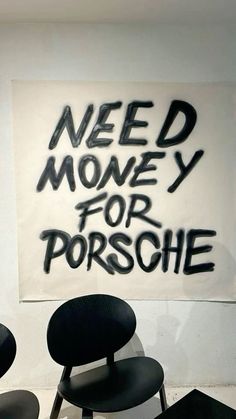 some chairs and a sign that says need money for porschie on the wall