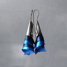 Avant garde efective earrings. They look fantastic on ear. They are made of oxidized sterling silver and silk ogranza in beatutif dark blue and blue colors. Earrings are effective and light. Enjoy colorful world of Shambala A few words about our works: All of the products in gallery are designed by us. Our studio is located in the beautiful seaside city of Gdańsk at Świętokrzyska Street. Everything is 100% handmade, with special attention to detail. In our work, you can find many collections ins Blue Bridal Earrings, Navy Blue Earrings, Seaside City, Fairy Earrings, Art Nouveau Earring, Wedding Silver, Blue Bridal, Colorful World, Emerald Earrings