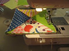 a close up of a sewing machine with fabric on it