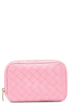 Perfect as an everyday makeup bag or a travel essential, this pretty-pink pouch with a signature handwoven intrecciato construction will always be appreciated. Zip-around closure Canvas lining Leather Made in Italy Designer Handbags Luxury Intrecciato Weave Clutch For Travel, Luxury Pink Pouch For Everyday Use, Intrecciato Weave Clutch Pouch For Travel, Designer Pink Pouch For Everyday Use, Luxury Pink Cosmetic Bag For Everyday Use, Luxury Pink Rectangular Cosmetic Bag, Designer Pink Travel Pouch, Luxury Pink Clutch For Travel, Luxury Pink Rectangular Coin Purse