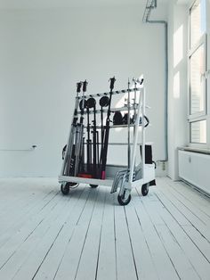 a small cart with skis on it in an empty room