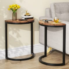 two side tables sitting next to each other near a couch