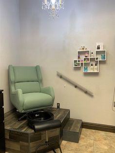 a chair and ottoman in a small room