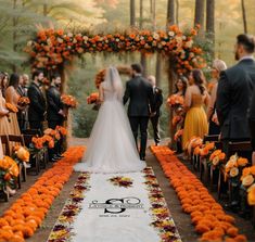 a bride and groom are walking down the aisle at their wedding ceremony with orange flowers