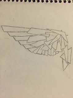 a pencil drawing of a wing on top of a piece of paper