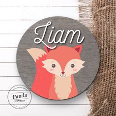 a wooden sign with an image of a fox and the word i am on it